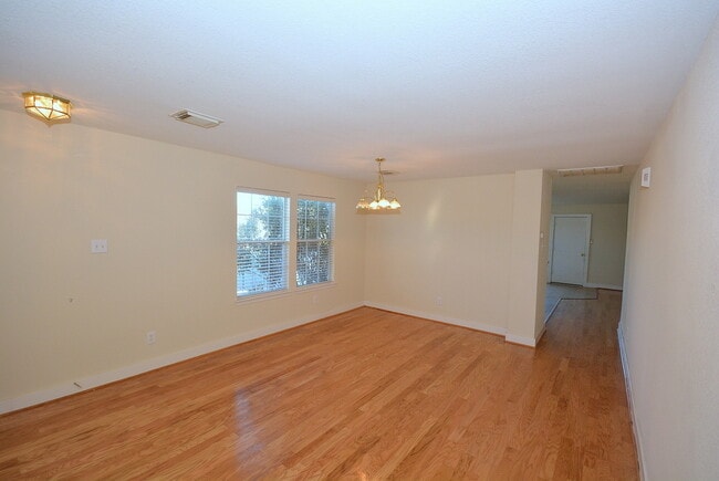 Photo - MOVE IN READY 3/2/2 WITH OPEN FLOOR PLAN. KITCHEN FEATURES OAK CABINETS, BLACK APPLICANCES AND BR...