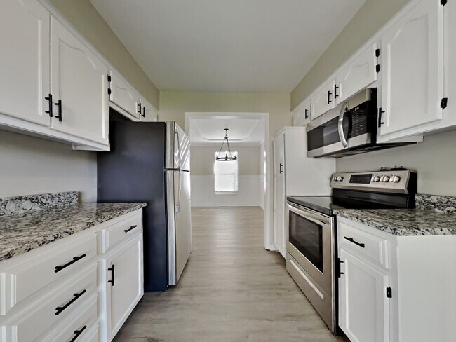 Photo - Charming 3-Bed, 2-Bath Home in Lee’s Summit | Cul-de-Sac, Fireplace & Fenced Yard