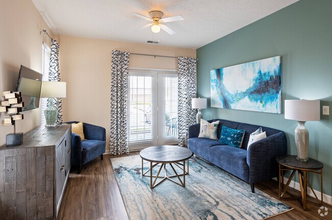 Spacious Living Room with Hardwood-Style Flooring - Hartshire Lakes Apartments