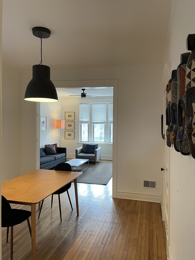 Dining room with chairs and table - 3489 N Elston Ave Unit 2