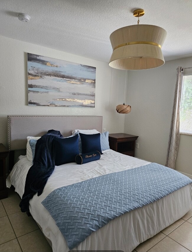 Large room with private bath that has a king size bed - 7702 NE 3rd Ct Apartments