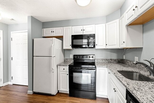 Photo - Updated 1BR Condo with Balcony, Garage Parking & Storage Near Commuter Rail Unit 101