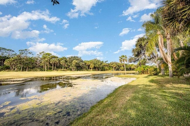 Photo - Luxurious 4 Bed/2.5 Bath Home with Stunning Lake and Golf Course Views with Pool on Savannahs Tra...