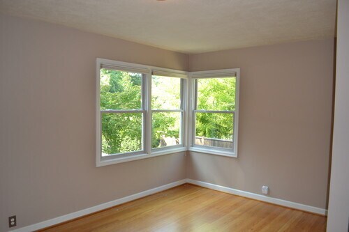 The master bedroom has beautiful views of the backyarf.