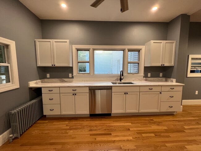 Eat-in kitchen with granite countertops and stainless steel appliances - 111 Falcon St Unit 2