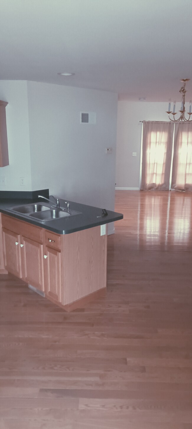 Kitchen open to living room - 602 Chatham Way Townhome