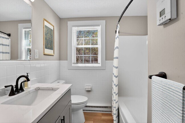 Welcome to Eagle Rock Apartments at Nashua, where modern comfort meets classic elegance. This stunning bathroom features contemporary fixtures and natural light, creating a refreshing retreat. Schedule your tour today and see your new home!