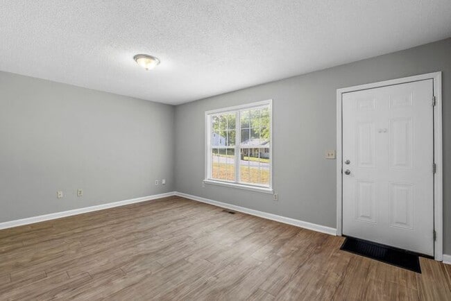 Photo - NW Home - Updated Kitchen and Bathrooms, Wood Laminate Flooring, Deck, Must See!