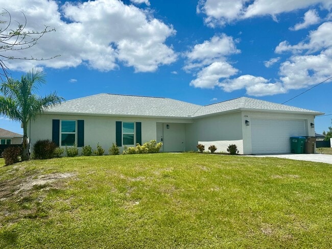 Building Photo - Available Now!! NW CAPE CORAL - 4 Bedrooms - 3 Bathrooms - 2 Car Garage