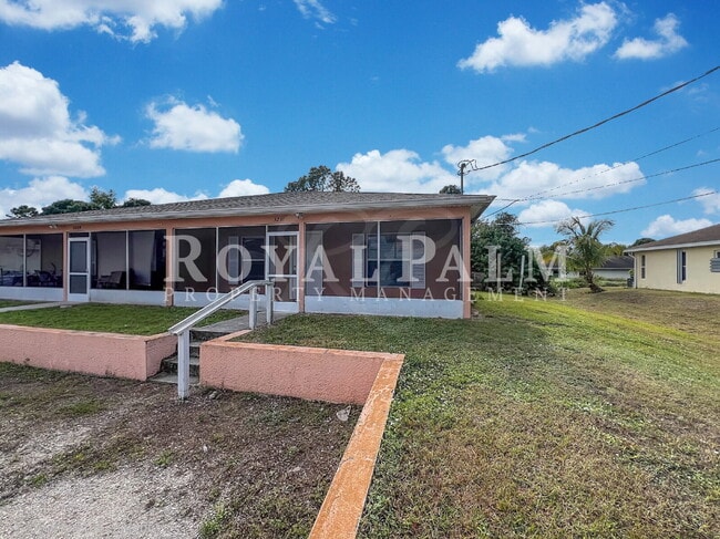 Photo - Your Duplex Dream Just Got Merrier! Charming 3-Bed, 2-Bath Home in Lehigh Acres!