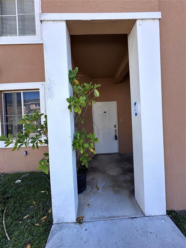 Building Photo - 7090 NW 177th St Unit 100-9