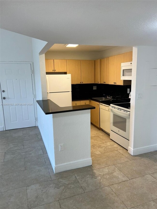 Building Photo - 7110 NW 179th St Unit 310