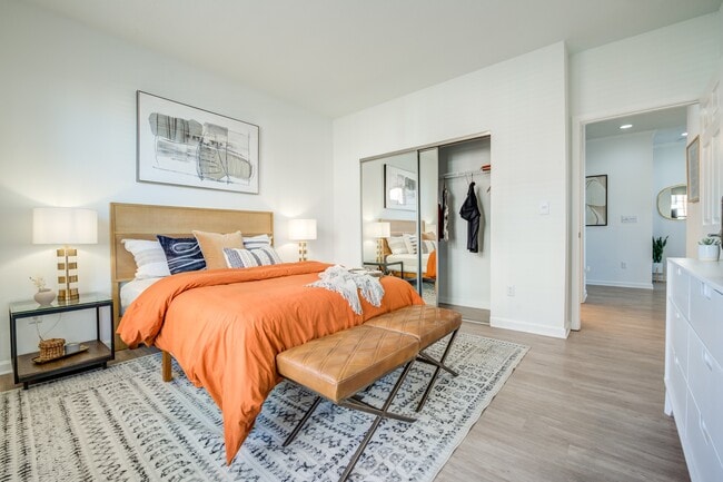 Spacious Bedroom with Hardwood-Style Flooring