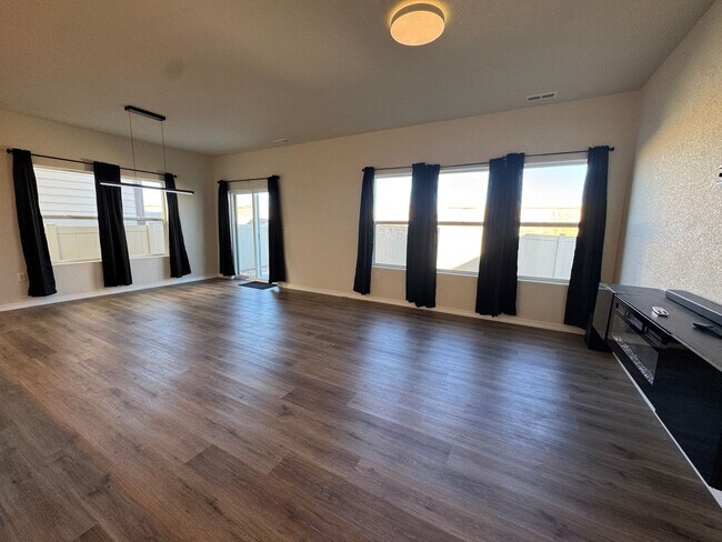 Photo - Spacious 3-Bedroom, 3-Bathroom Two-Story Home with Modern Finishes & Fenced Yard