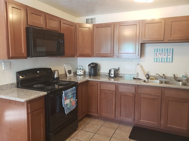 All Appliances Included - 1422 E Elm St Unit Front House