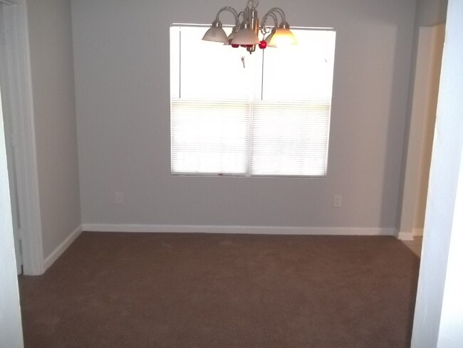 Photo - Freshly painted and new flooring in this 4 Bedroom 2 and Half Bath home. Covered front porch with...