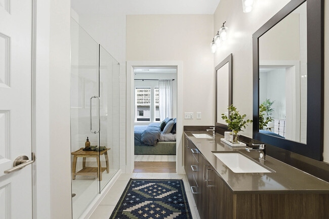 Spa bathroom with elegant glass shower with ceiling-height custom tile