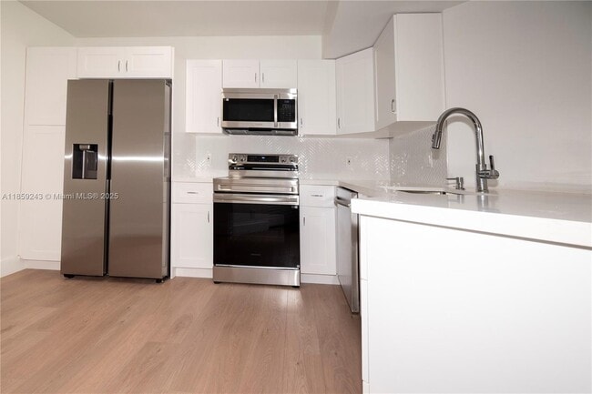 Building Photo - 8891 Wiles Rd Unit 305 Rental