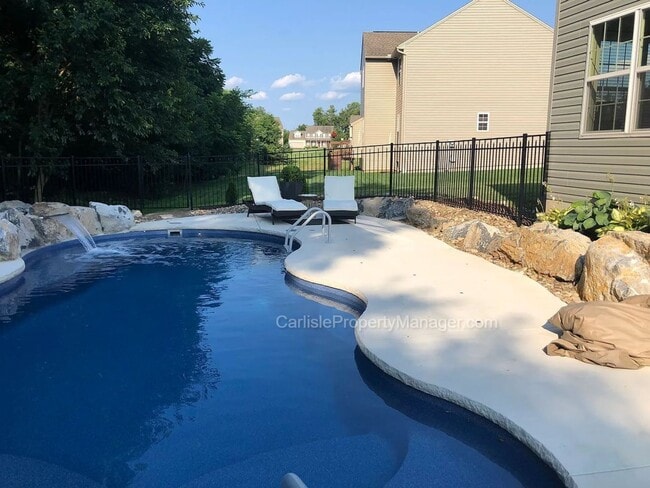 Photo - Modern Carlisle Rental with heated inground pool, fireplace, open floor plan, and finished basement