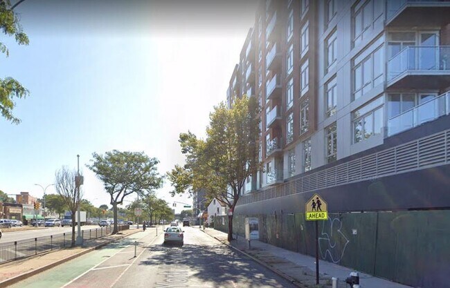 View along Queens Blvd - J & J Tower