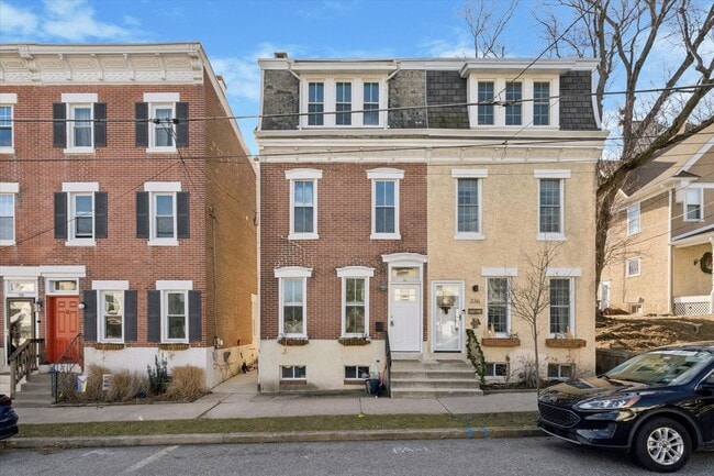 Building Photo - Stylish Phoenixville Rowhome with Exposed Brick, High Ceilings & Central Air