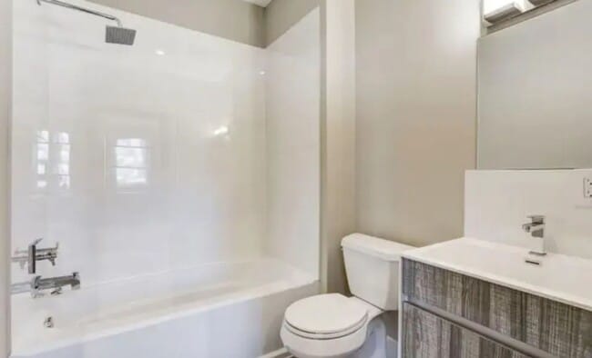 Photo - “Elegant 3-Story Home Showcasing High-End Renovation, Gourmet Kitchen, and Private Deck for Moder...