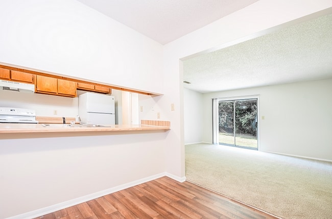 Experience the blend of style and comfort in this open-concept living area. - Corder Crossing