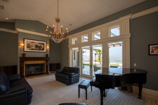 formal living room looks out to pool - 13368 Orions Flight Way