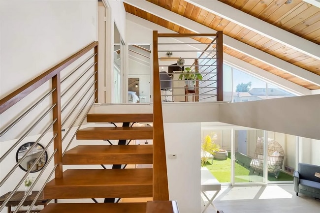 Photo - Spacious 1,550 Sq Ft Townhome | 2-Car Garage & High Ceilings w/ Exposed Beams