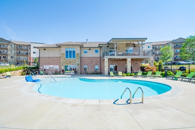 There's no better way to beat the heat than taking a dip in our resort-style pool. - The Flats at 84 Apartments