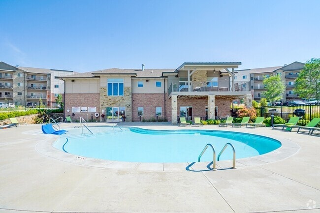 There's no better way to beat the heat than taking a dip in our resort-style pool. - The Flats at 84 Rental