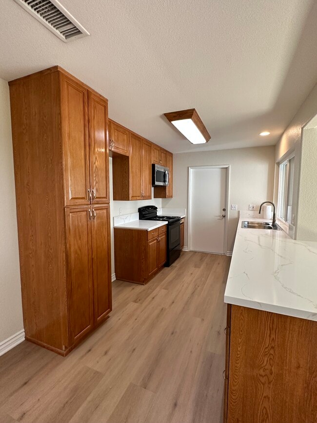 Cocina - 13784 Sycamore Tree Ln Casa Adosada