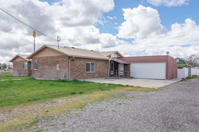 Photo - Spacious 3 Bed 2 Bath Brick Home with RV Parking, Shop Space & Large Yard in Tremonton!
