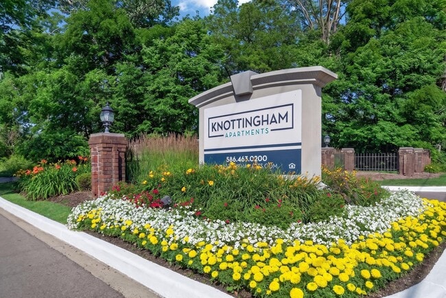 Welcoming entrance at Knottingham Apartments in Clinton Township, MI.