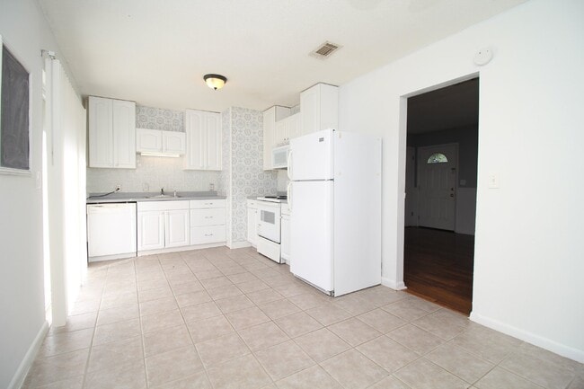 Photo - Spacious 3BR/1.5BA Home in Pace with Open Living Area, Tiled Family Room, and Fenced Backyard – M...