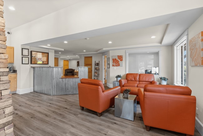 Welcoming leasing office with cozy lounge seating and friendly service.