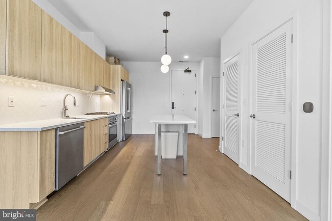 Building Photo - 7175 12th St NW Unit 210