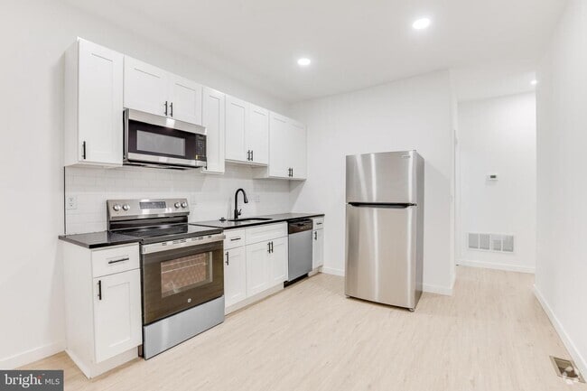 Building Photo - 5855 Larchwood Ave Unit 1 Rental