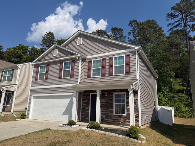 Photo - "Charming 3-Bed Oasis on Finnigan Rd: Spacious 1,994 Sq Ft with Granite Kitchen & Cozy Fireplace!"