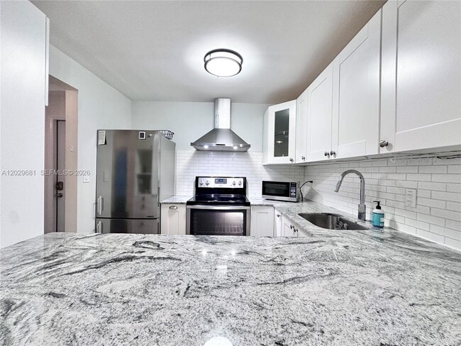 Building Photo - 9974 SW 88th St Unit 1016