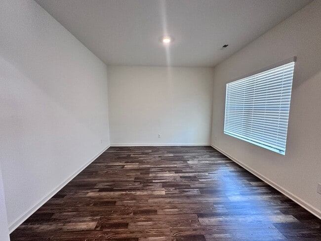 Photo - efficient two-level home provides a large living room, 4 very spacious bedrooms, and 2.5 bathrooms
