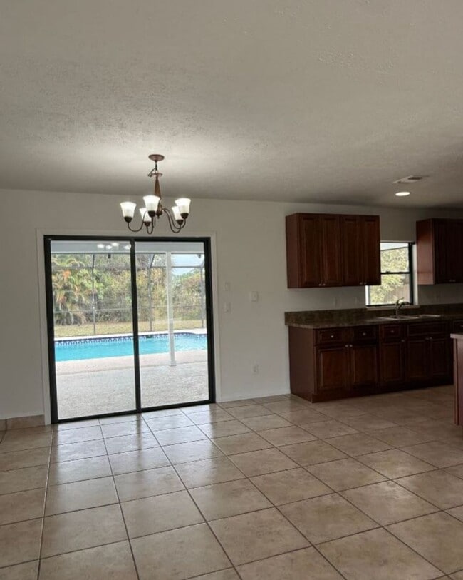 Photo - 3/2/1 with screened in patio/pool