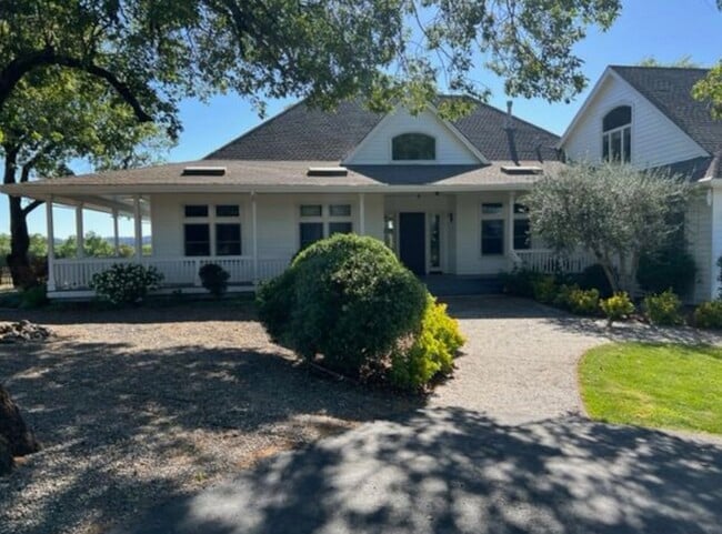 modern farmhouse with wrap around porch - 150 Old Vine Ln