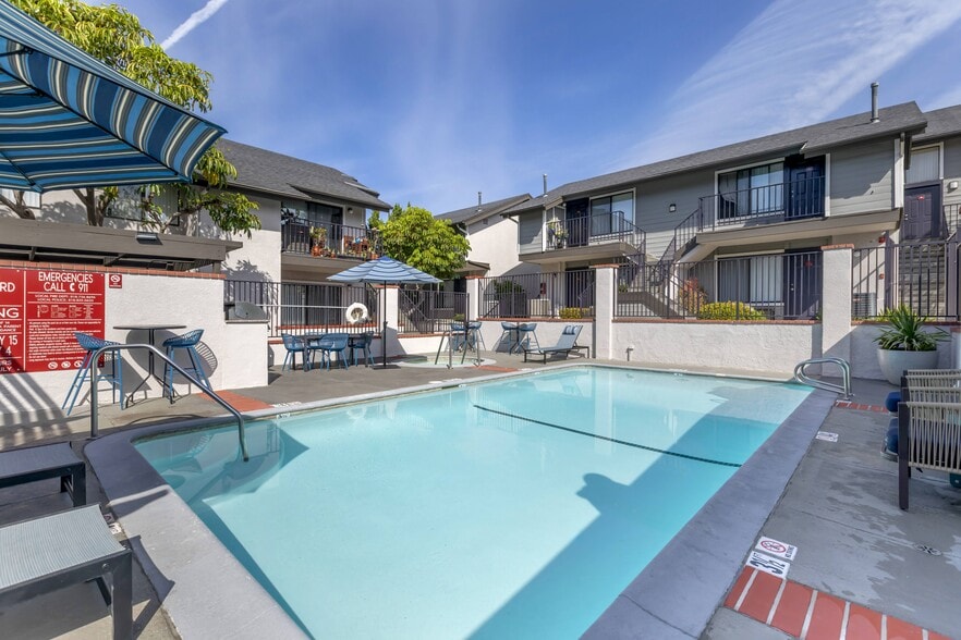 Dive into luxury living at Independence Plaza, where every day feels like a vacation with our refreshing swimming pool and stylish patio retreat adorned with cozy umbrellas.