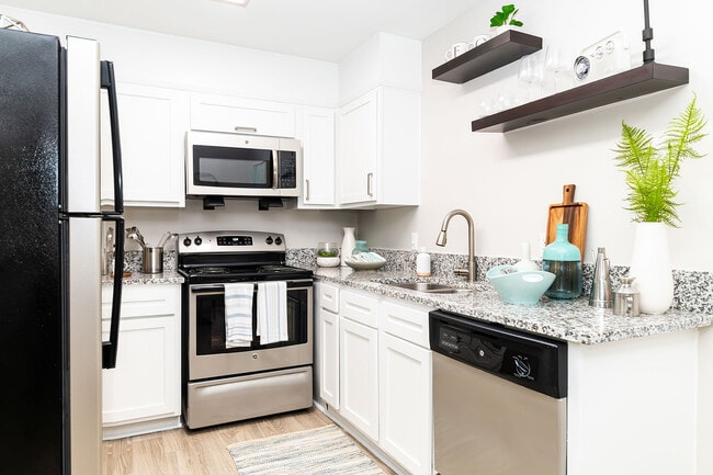 Kitchen with granite counters and stainless appliances