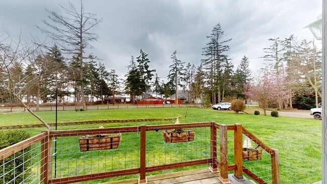 Photo - Wake up just steps from Penn Cove with space to spread out, store your boat, and fully enjoy Whid...