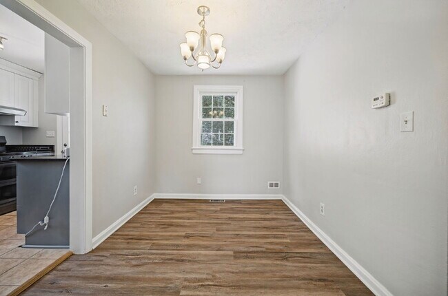 RARE FIND-4 BEDROOMS, 2 BATHROOMS, FENCED BACK YARD and GARAGE-PETS!!