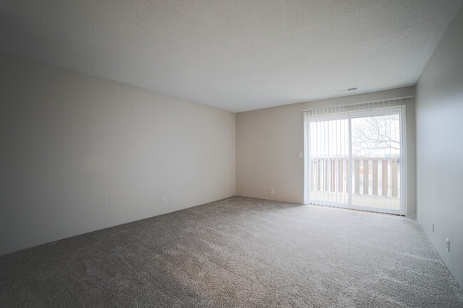 Living room w/ balcony - LongLeaf Apartments