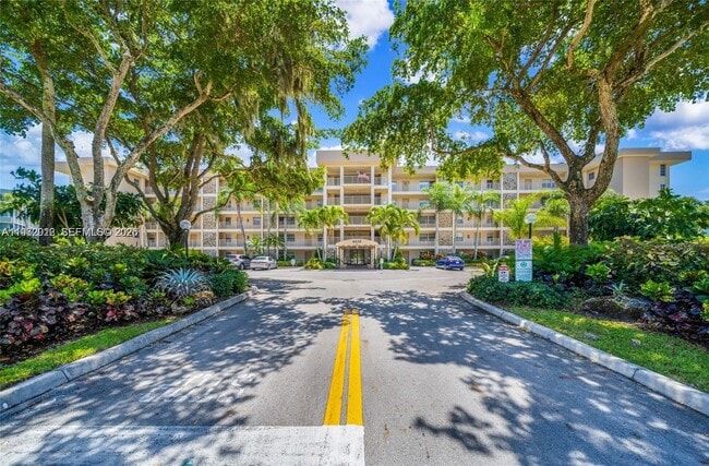 Building Photo - 4030 W Palm Aire Dr Unit 104