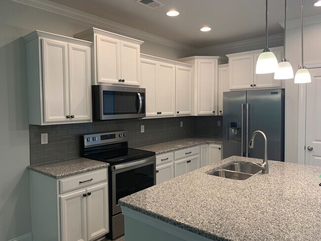 Photo - 4 Bedroom, 2.5 Bath, Pet Friendly Town Home with Garage Within Barefoot Resort and Golf! Availabl...